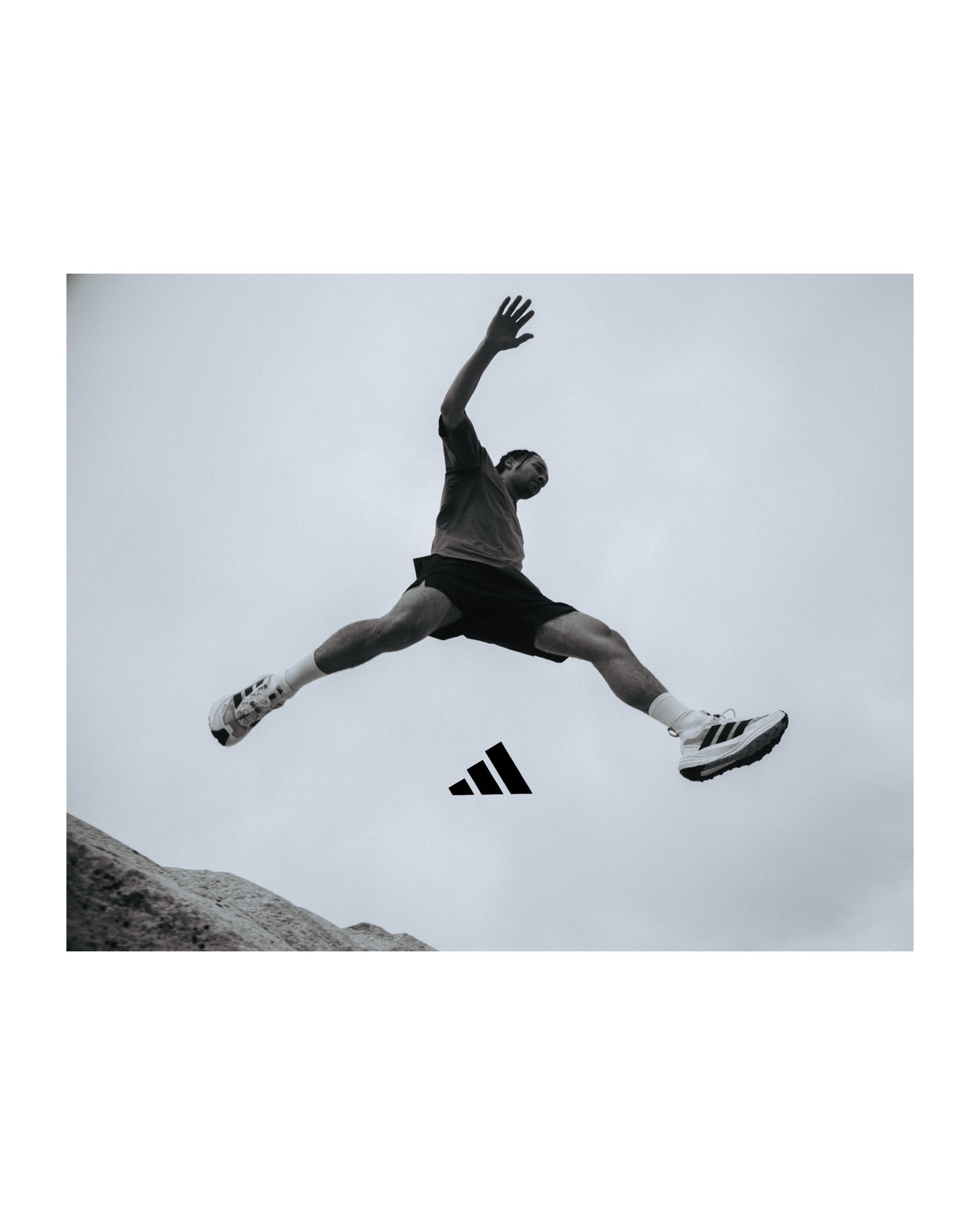 Adidas Terrex athlete leaping above rocky terrain during the Freehiker stills campaign
