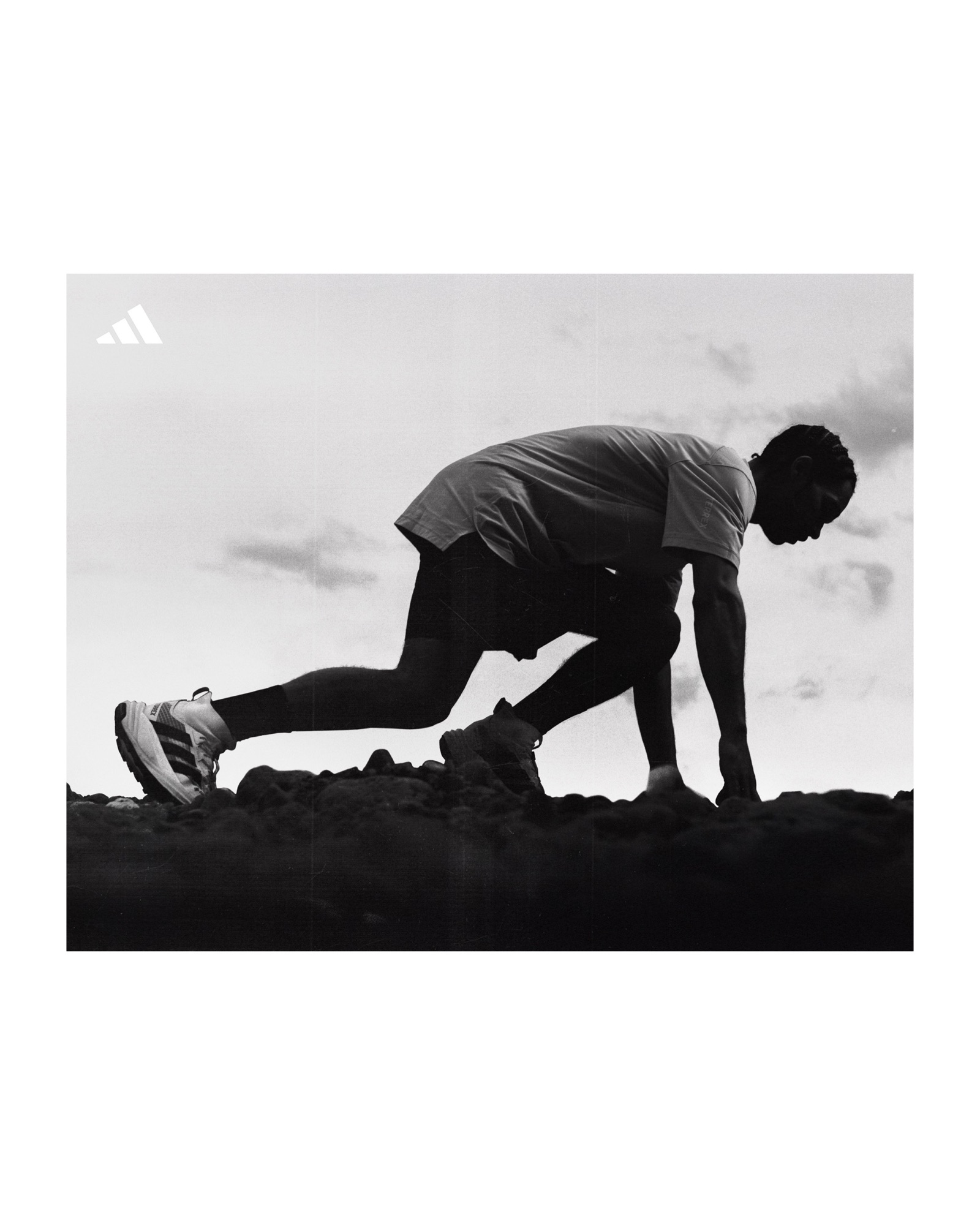 Adidas Terrex athlete crouched at the start on rocky ground during the Freehiker campaign